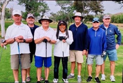 A group of people standing on a golf course

AI-generated content may be incorrect.